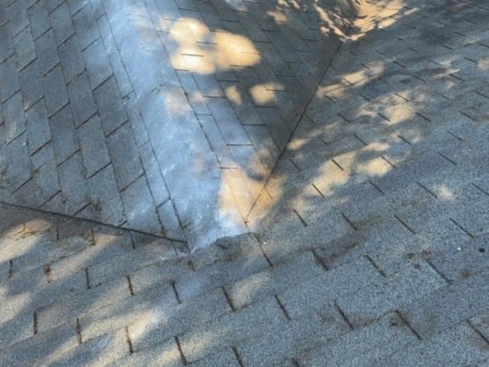 Roof Cleaning after: A moss-covered ridge cleared, treated, and rinsed back to a clean surface.